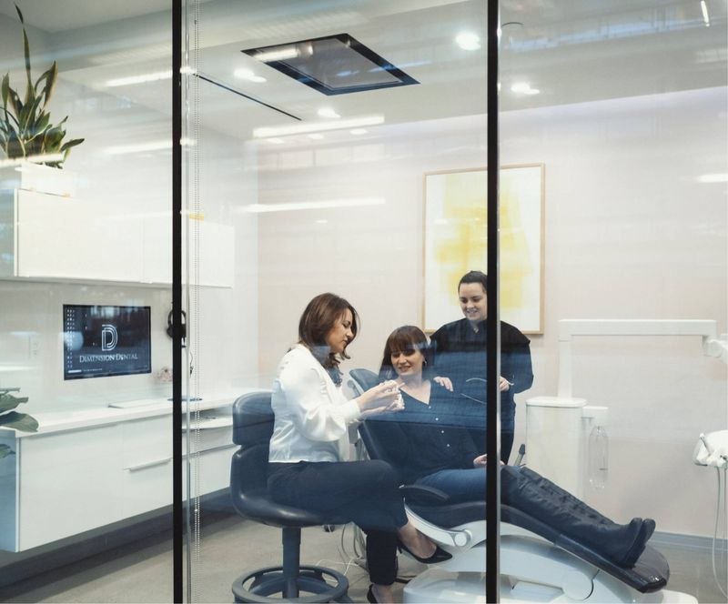 Dentist consulting with patient in chair at a Holmdel dental office