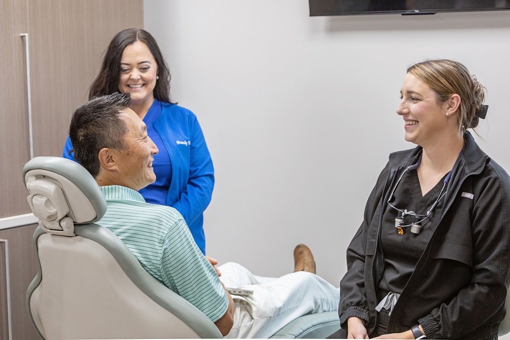 Auburn dentist talking with patient at Thrive Family Dentistry
