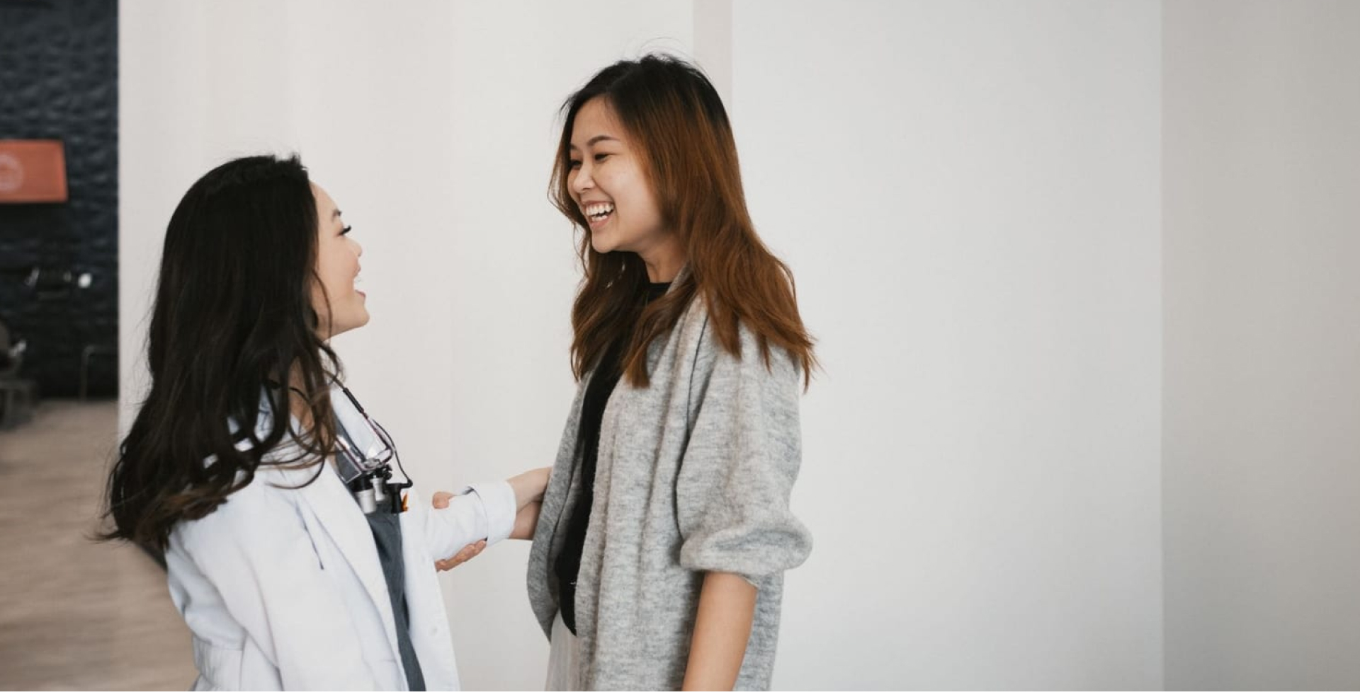 dr bella smiling with a satisfied patient