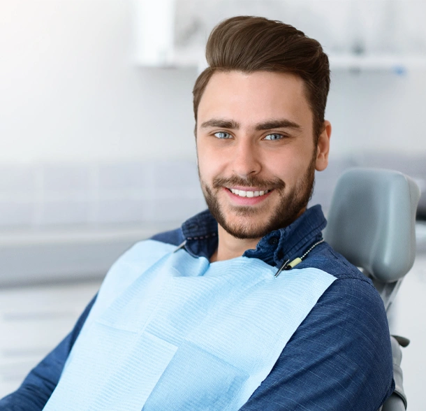 Male patients showing their smile after dental cleaning