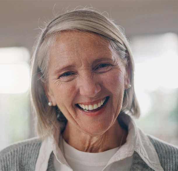 Old women smile after dental Implants treatment in Phoenix